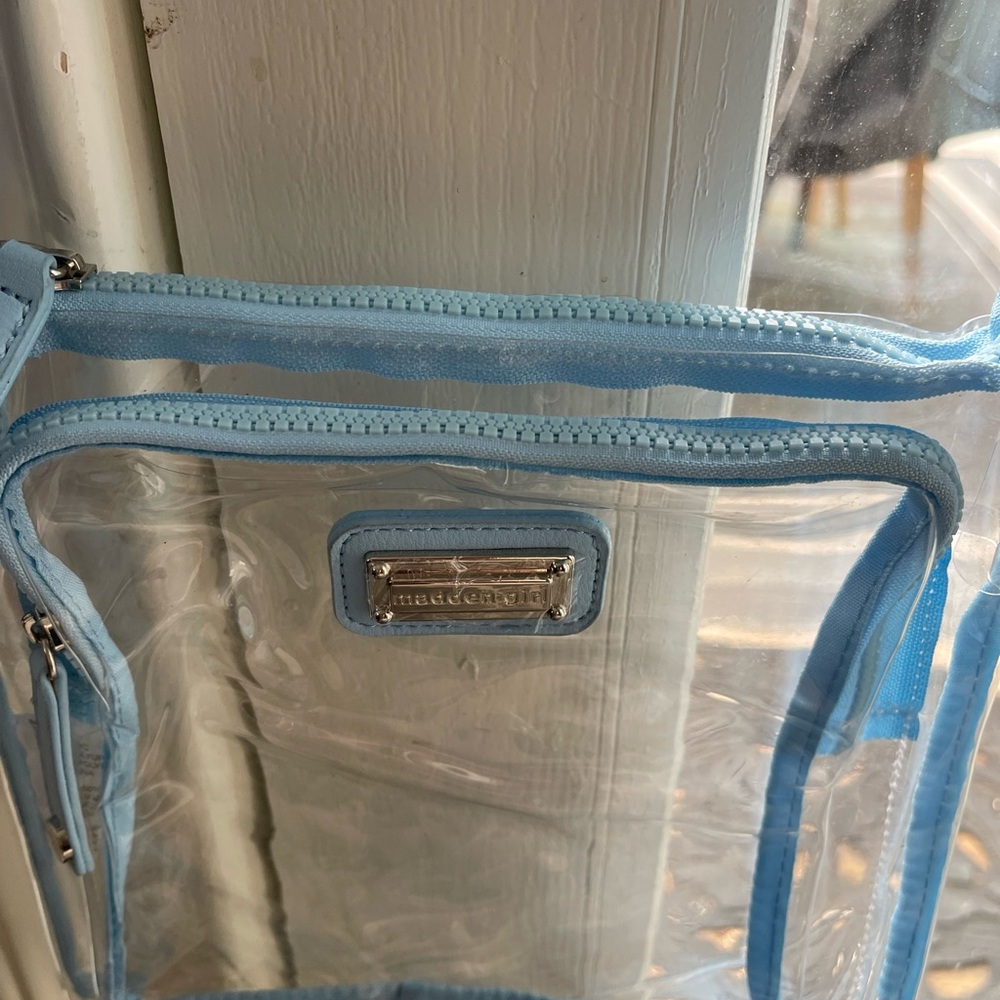 Clear purse outlined in light blue